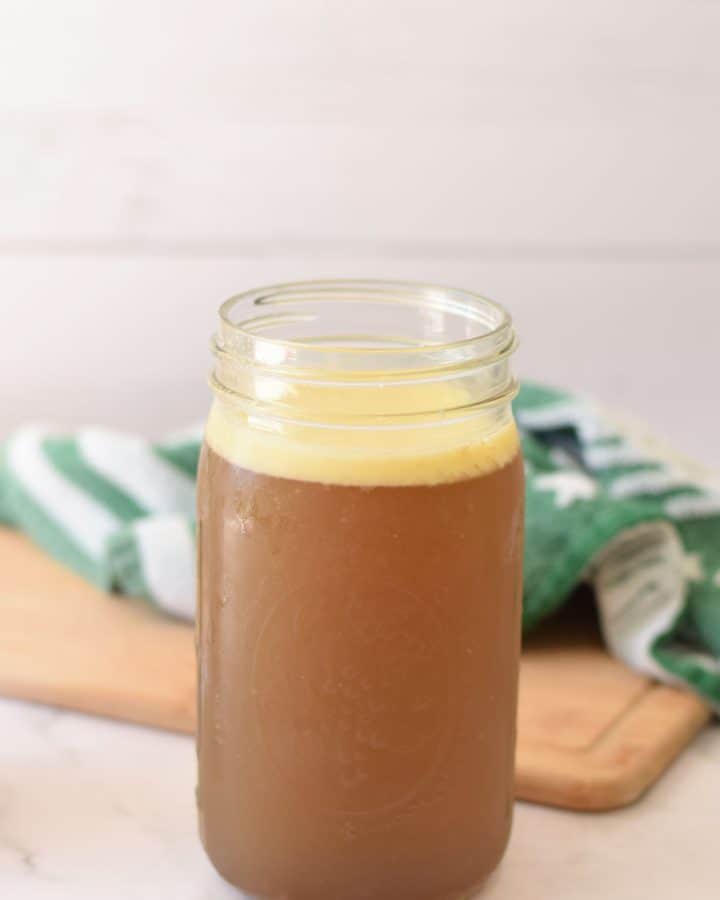 Gut-healing homemade beef meat stock in a glass jar