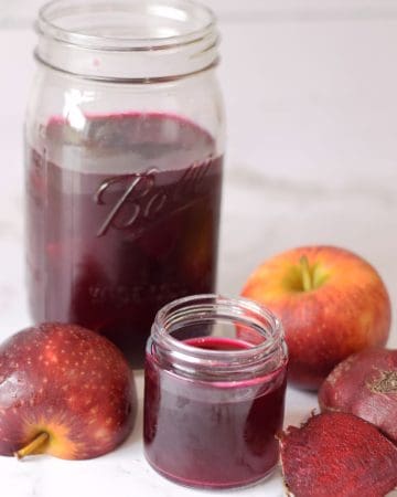 Homemade apple beet kvass drink with fresh apple and beetroot